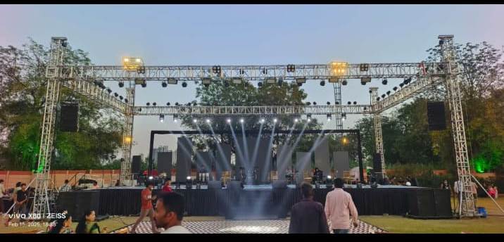 Large LED wall stage backdrop with truss lighting at an Ahmedabad event