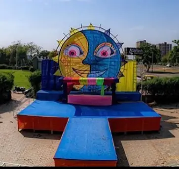 Colourful giant sun-face stage backdrop from Go Pagal Holi in Ahmedabad